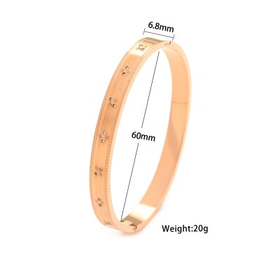 Ατσάλινη επίχρυση χειροπέδα με ανάγλυφα στοιχεία